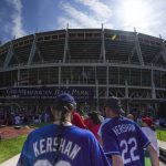 
              Los Angeles Dodgers' fans wait outside of Great American Ball Park prior to a baseball game between the Cincinnati Reds and the Los Angeles Dodgers in Cincinnati, Sunday, Sept 19, 2021. (AP Photo/Bryan Woolston)
            