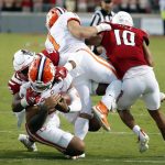 
              North Carolina State's Savion Jackson (90) tackles Clemson's D.J. Uiagalelei (5) as the left leg of Clemson running back Will Shipley (1) gets caught with North Carolina State's Tanner Ingle (10) also defending during the second half of an NCAA college football game in Raleigh, N.C., Saturday, Sept. 25, 2021. (AP Photo/Karl B DeBlaker)
            