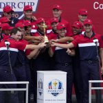 
              Team USA poses with the trophy at the closing ceremony after the Ryder Cup matches at the Whistling Straits Golf Course Sunday, Sept. 26, 2021, in Sheboygan, Wis. (AP Photo/Jeff Roberson)
            