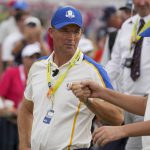 
              Team Europe captain Padraig Harrington talks to Team Europe's Ian Poulter on the 15th hole during a Ryder Cup singles match at the Whistling Straits Golf Course Sunday, Sept. 26, 2021, in Sheboygan, Wis. (AP Photo/Charlie Neibergall)
            