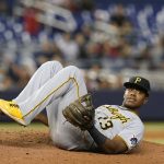 
              Pittsburgh Pirates third baseman Ke'Bryan Hayes (13) lies on the pitcher's mound after he fell while trying to catch a pop fly by Miami Marlins' Lewis Brinson, who ended up with a single during the ninth inning of a baseball game Saturday, Sept. 18, 2021, in Miami. The Pirates won 6-3. (AP Photo/Marta Lavandier)
            