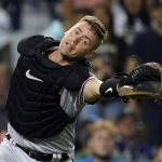 
              Arizona Diamondbacks catcher Carson Kelly reaches but cannot catch a foul ball from Los Angeles Dodgers' Cody Bellinger during the seventh inning of a baseball game Monday, Sept. 13, 2021, in Los Angeles. (AP Photo/Marcio Jose Sanchez)
            