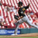 
              Pittsburgh Pirates' Connor Overton throws during the first inning of a baseball game against the Cincinnati Reds in Cincinnati, Monday, Sept. 27, 2021. (AP Photo/Aaron Doster)
            