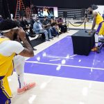 
              Los Angeles Lakers forward LeBron James, right, has his photo taken by teammate Anthony Davis during the NBA basketball team's Media Day Tuesday, Sept. 28, 2021, in El Segundo, Calif. (AP Photo/Marcio Jose Sanchez)
            