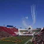 
              Airplanes fly over Los Angeles Memorial Coliseum before an NCAA college football game between San Jose State and Southern California Saturday, Sept. 4, 2021, in Los Angeles. (AP Photo/Ashley Landis)
            