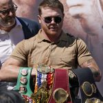 
              Unified WBC/WBO/WBA super middleweight champion Canelo Alvarez poses with his belts during a news conference Tuesday, Sept. 21, 2021, in Beverly Hills, Calif. to announce his 168-pound title bout against undefeated IBF Super Middleweight Champion Caleb Plant. The fight is scheduled for Saturday, Nov. 6 in Las Vegas. (AP Photo/Mark J. Terrill)
            