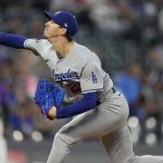 
              Los Angeles Dodgers starting pitcher Walker Buehler works against the Colorado Rockies in the first inning of a baseball game Wednesday, Sept. 22, 2021, in Denver. (AP Photo/David Zalubowski)
            