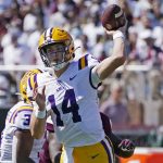 
              LSU quarterback Max Johnson (14) passes against Mississippi State during the first half of an NCAA college football game, Saturday, Sept. 25, 2021, in Starkville, Miss. (AP Photo/Rogelio V. Solis)
            