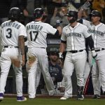 
              Seattle Mariners' Mitch Haniger (17) is greeted by teammates after he hit a three-run go-ahead home run against the Boston Red Sox during the seventh inning of a baseball game, Monday, Sept. 13, 2021, in Seattle. (AP Photo/Ted S. Warren)
            