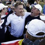 
              Europe's Luke Donald, , left, Ian Poulter, center, Lee Westwood and Rory McIlroy, obscured at far right, celebrate after winning the Ryder Cup PGA golf tournament at the Medinah Country Club in Medinah, Ill., in this Sunday, Sept. 30, 2012, file photo. (AP Photo/David J. Phillip, File)
            