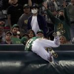 
              Oakland Athletics' Matt Chapman dives for a foul ball hit by Seattle Mariners' Jake Bauers during the fourth inning of a baseball game in Oakland, Calif., Tuesday, Sept. 21, 2021. (AP Photo/Jed Jacobsohn)
            