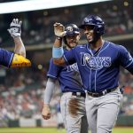 
              Tampa Bay Rays' Yandy Diaz, right, celebrates with Wander Franco, left, after hitting a two-run home run against the Houston Astros during the first inning of a baseball game Tuesday, Sept. 28, 2021, in Houston. Tampa Bay Rays' Brandon Lowe, rear, scored on Diaz's homer. (AP Photo/David J. Phillip)
            