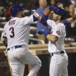 
              New York Mets' Jeff McNeil, right, celebrates with teammate Tomas Nido after hitting a home run during the seventh inning of a baseball game against the Philadelphia Phillies, Sunday, Sept. 19, 2021, in New York. (AP Photo/Jason DeCrow)
            