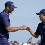 
              Team USA's Dustin Johnson and Team USA's Collin Morikawa celebrate on the 15th hole during a foursomes match the Ryder Cup at the Whistling Straits Golf Course Saturday, Sept. 25, 2021, in Sheboygan, Wis. (AP Photo/Charlie Neibergall)
            