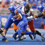 
              Boise State running back George Holani (24) is stopped by Oklahoma State linebacker Malcolm Rodriguez (20) during the first half of an NCAA college football game Saturday, Sept. 18, 2021, in Boise, Idaho. (AP Photo/Steve Conner)
            