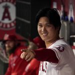 
              Los Angeles Angels designated hitter Shohei Ohtani gestures to other players in the dugout during the first inning of a baseball game against the Houston Astros Thursday, Sept. 23, 2021, in Anaheim, Calif. (AP Photo/Mark J. Terrill)
            
