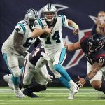 
              Carolina Panthers quarterback Sam Darnold (14) breaks away from Houston Texans defensive tackle Roy Lopez (91) during the second half of an NFL football game Thursday, Sept. 23, 2021, in Houston. (AP Photo/Eric Christian Smith)
            