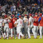 
              The Philadelphia Phillies celebrate after defeating the New York Mets in a baseball game, Saturday, Sept. 18, 2021, in New York. The Phillies won 5-3. (AP Photo/Mary Altaffer)
            