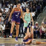 
              Phoenix Mercury guard Kia Nurse (0) celebrates with guard Sophie Cunningham (9) in front of New York Liberty guard Rebecca Allen (9) during the second half in the first round of the WNBA basketball playoffs, Thursday, Sept. 23, 2021, in Phoenix. Phoenix won 83-82. (AP Photo/Rick Scuteri)
            