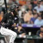 
              Colorado Rockies' Charlie Blackmon singles against San Francisco Giants starting pitcher Anthony DeSclafani in the third inning of a baseball game Saturday, Sept. 25, 2021, in Denver. (AP Photo/David Zalubowski)
            