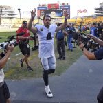 
              Las Vegas Raiders quarterback Derek Carr (4) waves to fans as he heads to the locker room following an NFL football game against the Pittsburgh Steelers in Pittsburgh, Sunday, Sept. 19, 2021. (AP Photo/Don Wright)
            