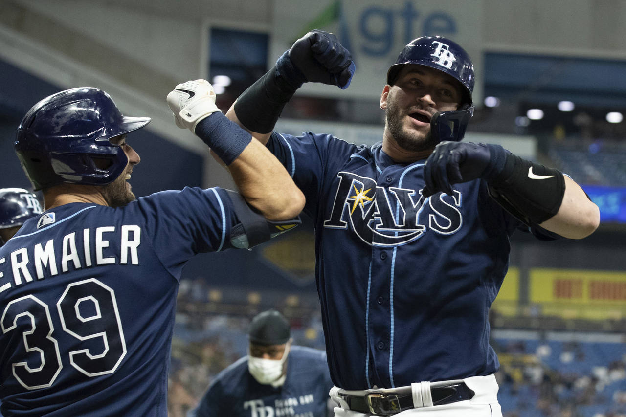 Tampa Bay Rays' Mike Zunino, right, celebrates with Kevin Kiermaier after hitting a two-run home ru...
