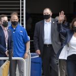 
              Vice President Kamala Harris waves as she walks on to the field before an NCAA college football game between Howard and Hampton at Audi Field in Washington, Saturday, Sept. 18, 2021. Harris attended Howard University and graduated in 1986. (AP Photo/Cliff Owen)
            