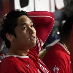 
              Los Angeles Angels' Shohei Ohtani sits in the dugout after being called out on strikes during the fourth inning of the team's baseball game against the Chicago White Sox on Tuesday, Sept. 14, 2021, in Chicago. (AP Photo/Charles Rex Arbogast)
            