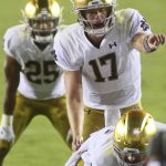
              Notre Dame quarterback Jack Coan (17) motions in the third quarter of an NCAA college football game against Florida State Sunday, Sept. 5, 2021, in Tallahassee, Fla. (AP Photo/Phil Sears)
            