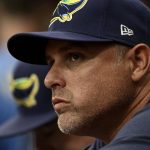
              Tampa Bay Rays manager Kevin Cash watches from the dugout during the fourth inning of a baseball game against the Miami Marlins, Sunday, Sept. 26, 2021, in St. Petersburg, Fla. (AP Photo/Steve Nesius)
            