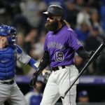 
              Colorado Rockies' Charlie Blackmon reacts after striking out with the bases loaded against Los Angeles Dodgers relief pitcher Blake Treinen to end the seventh inning of a baseball game Tuesday, Sept. 21, 2021, in Denver. (AP Photo/David Zalubowski)
            