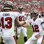 
              Tampa Bay Buccaneers quarterback Tom Brady (12) celebrates with wide receiver Mike Evans (13) after Evans caught a 3-yard touchdown pass during the first half of an NFL football game Sunday, Sept. 19, 2021, in Tampa, Fla. (AP Photo/Mark LoMoglio)
            
