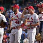 
              St. Louis Cardinals manager Mike Shildt, second from right, talks with shortstop Paul DeJong, left, first baseman Paul Goldschmidt, second from left, and catcher Andrew Knizner, right, as they wait for relief pitcher Andrew Miller during the sixth inning of a baseball game against the Chicago Cubs in Chicago, Sunday, Sept. 26, 2021. (AP Photo/Nam Y. Huh)
            