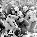 
              FILE - In this Nov. 25, 1971, file photo, Nebraska's Rich Glover (79) brings down Oklahoma quarterback Jack Mildren (11) as Nebraska defenders Bob Terrio (45) and Dave Mason (25) close in during a college football game in Norman, Okla., on Thanksgiving Day. The game on Thanksgiving 50 years ago is back in the spotlight as Nebraska and Oklahoma renew their rivalry on Saturday, Sept. 18, 2021. (Lincoln Journal Star via AP, File)
            