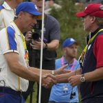 
              Team USA captain Steve Stricker shakes hands with Team Europe captain Padraig Harrington after the Ryder Cup matches at the Whistling Straits Golf Course Sunday, Sept. 26, 2021, in Sheboygan, Wis. (AP Photo/Charlie Neibergall)
            