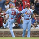 
              St. Louis Cardinals' Harrison Bader (48) celebrates with teammate Paul DeJong (11) after hitting a solo home run during the second inning of a baseball game against the Chicago Cubs Saturday, Sept. 25, 2021, in Chicago. (AP Photo/Paul Beaty)
            