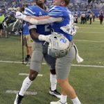 
              Memphis defensive back Julian Barnett, left, and wide receiver Koby Drake celebrate after an NCAA college football game against Mississippi State, Saturday, Sept. 18, 2021, in Memphis, Tenn. (AP Photo/John Amis)
            
