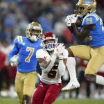 
              UCLA defensive back Evan Thomas (28) intercepts a pass intended for Fresno State wide receiver Jalen Cropper (5) during the first half of an NCAA college football game Saturday, Sept. 18, 2021, in Pasadena, Calif. (AP Photo/Marcio Jose Sanchez)
            