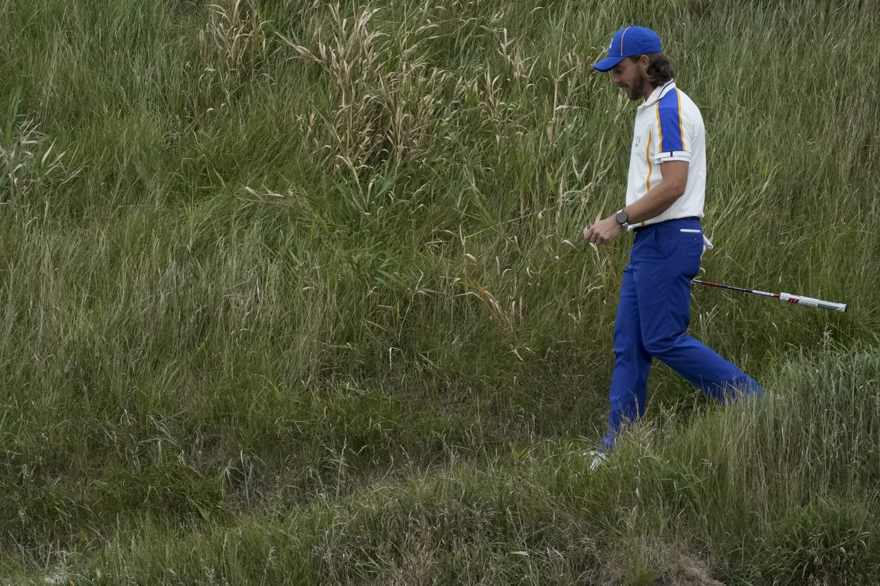 Team Europe's Tommy Fleetwood walks on the 18th hole during the Ryder Cup singles matches at the Wh...