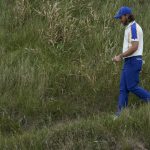 
              Team Europe's Tommy Fleetwood walks on the 18th hole during the Ryder Cup singles matches at the Whistling Straits Golf Course Sunday, Sept. 26, 2021, in Sheboygan, Wis. (AP Photo/Charlie Neibergall)
            