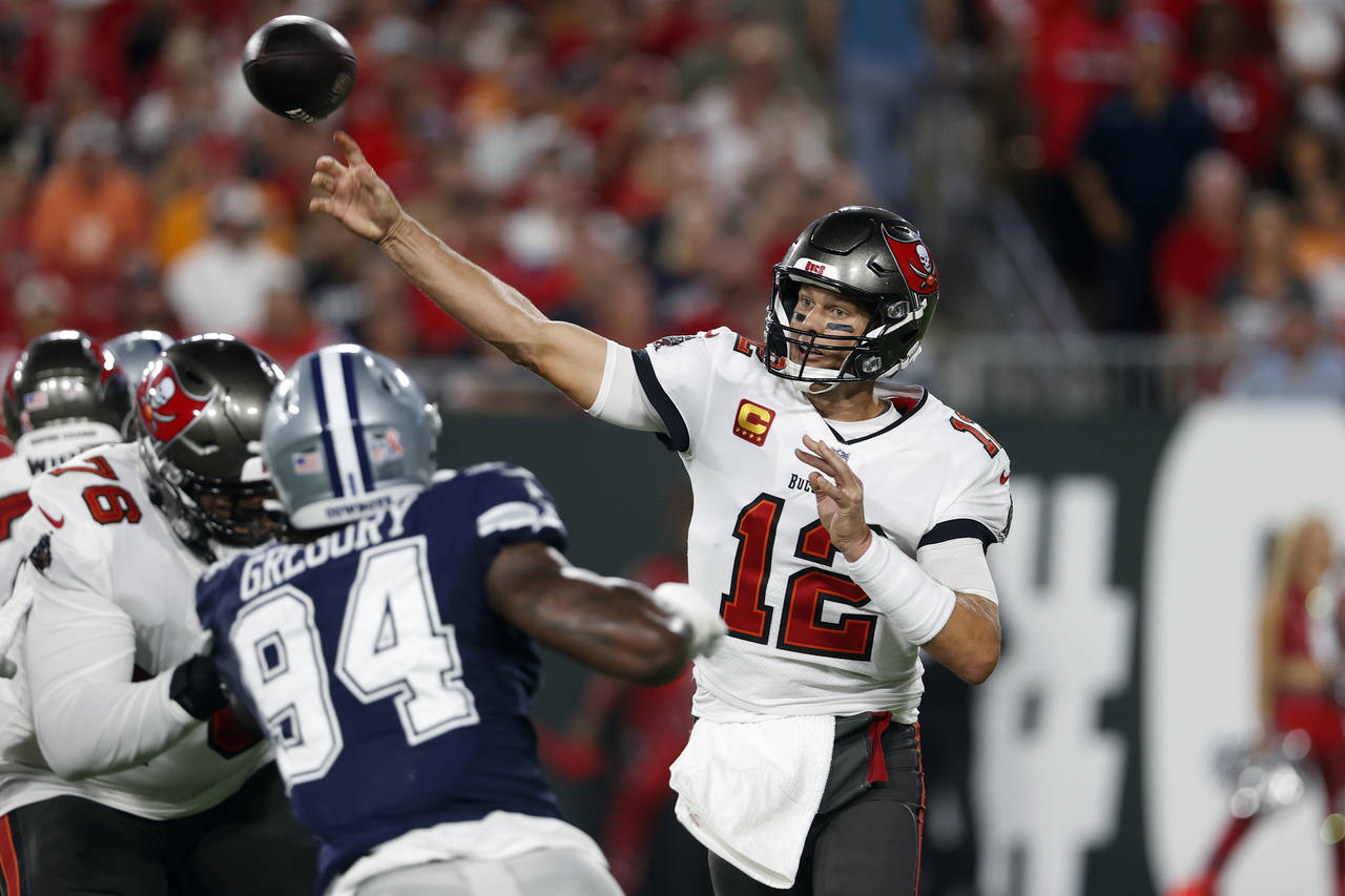 Tampa Bay Buccaneers quarterback Tom Brady (12) fires a pass against the Dallas Cowboys during the ...