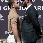 
              Unified WBC/WBO/WBA super middleweight champion Canelo Alvarez, left, faces off with undefeated IBF Super Middleweight Champion Caleb Plant during a news conference Tuesday, Sept. 21, 2021, in Beverly Hills, Calif. to announce their 168-pound title bout. The fight is scheduled for Saturday, Nov. 6 in Las Vegas. (AP Photo/Mark J. Terrill)
            