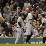 
              New York Yankees' Giancarlo Stanton, center, celebrates his grand slam that also drove in, from left, Aaron Judge, Anthony Rizzo and Brett Gardner during the eighth inning of a baseball game against the Boston Red Sox, Saturday, Sept. 25, 2021, in Boston. (AP Photo/Michael Dwyer)
            