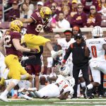 
              Minnesota tight end Brevyn Spann-Ford (88) leaps over Bowling Green cornerback Marcus Sheppard (21) during an NCAA college football game Saturday, Sept. 25, 2021, in Minneapolis. (AP Photo/Stacy Bengs)
            