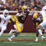 
              Minnesota quarterback Tanner Morgan (2) scrambles with the ball during an NCAA college football game against Bowling Green, Saturday, Sept. 25, 2021, in Minneapolis. (AP Photo/Stacy Bengs)
            
