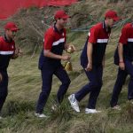 
              Team USA players head to the clubhouse after the Ryder Cup matches at the Whistling Straits Golf Course Sunday, Sept. 26, 2021, in Sheboygan, Wis. (AP Photo/Charlie Neibergall)
            