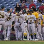 
              Oakland Athletics players celebrate a win over the Los Angeles Angels in a baseball game Sunday, Sept. 19, 2021, in Anaheim, Calif. (AP Photo/Jae C. Hong)
            