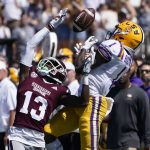 
              Mississippi State cornerback Emmanuel Forbes (13) knocks away a pass intended for LSU wide receiver Kayshon Boutte (1) during the first half of an NCAA college football game, Saturday, Sept. 25, 2021, in Starkville, Miss. (AP Photo/Rogelio V. Solis)
            