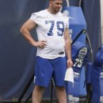 
              FILE - In this May 27, 2021, file photo, Indianapolis Colts' Eric Fisher watches during NFL football practice in Indianapolis. After eight seasons in Kansas City, he was released in March as a cost-cutting move and spent the next two months uncertain about his future. In May, he finally signed with the Indianapolis Colts. And now, following nearly eight months of rehab, the two-time Pro Bowl left tackle appears to be nearing a return.(AP Photo/Darron Cummings, File)
            