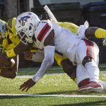 
              Oregon quarterback Anthony Brown (13) scores as he is hit by Stony Brook defensive back Carthell Flowers (17) during the second quarter of an NCAA college football game Saturday, Sept. 18, 2021, in Eugene, Ore. (AP Photo/Andy Nelson)
            